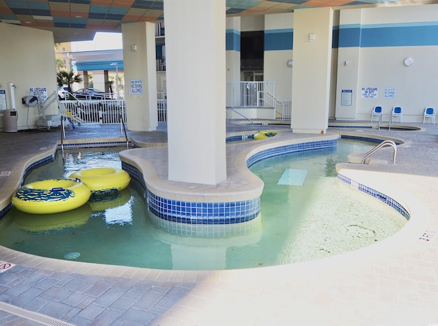 pool featuring a patio and fence