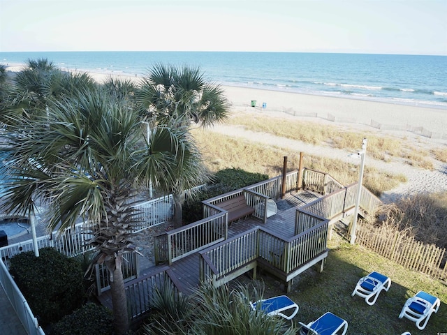 bird's eye view with a water view and a beach view