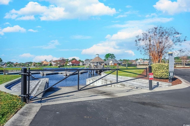 view of gate featuring a water view