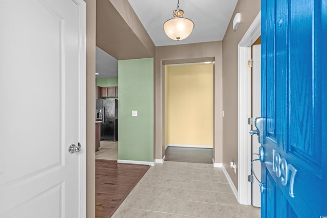 entrance foyer with light tile patterned floors