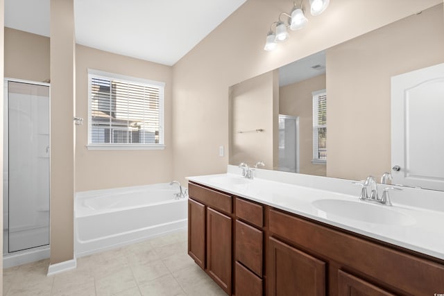 bathroom with tile patterned flooring, vanity, and independent shower and bath