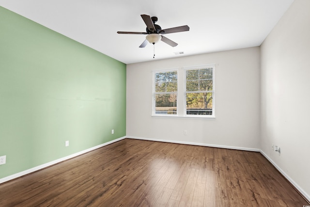 unfurnished room with ceiling fan and hardwood / wood-style flooring