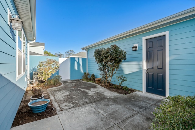 doorway to property with a patio