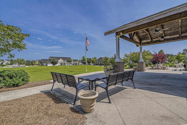 view of property's community with a gazebo, an outdoor hangout area, a yard, and a patio