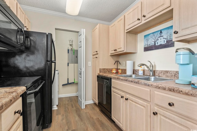 kitchen with sink, a textured ceiling, ornamental molding, and black appliances