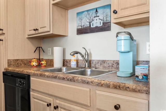 kitchen with light brown cabinetry, sink, and black dishwasher