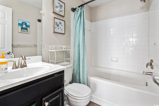 full bathroom with shower / bath combination with curtain, vanity, and toilet