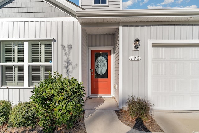 view of exterior entry featuring a garage