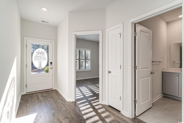 entryway with light hardwood / wood-style floors