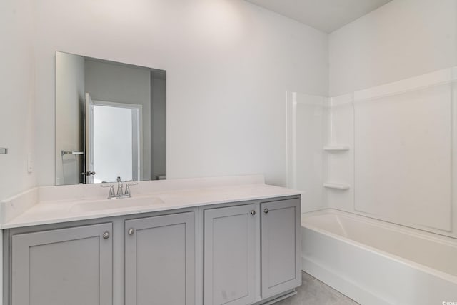 bathroom featuring shower / bathing tub combination, vanity, and tile patterned flooring