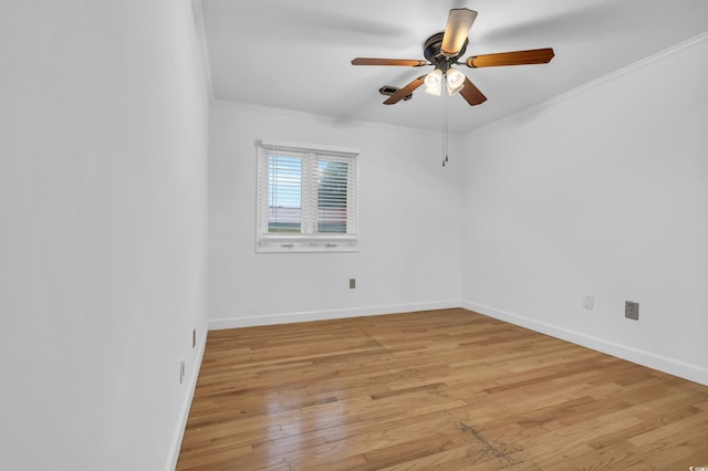 unfurnished room featuring ceiling fan, light wood-type flooring, and crown molding