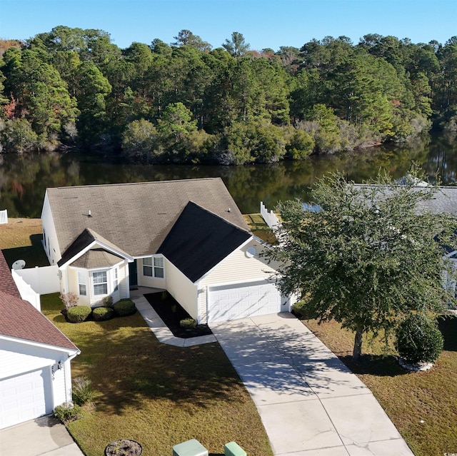 birds eye view of property with a water view