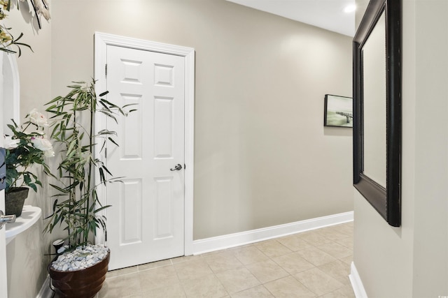 hallway with light tile patterned floors