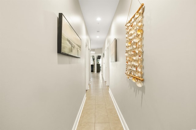 hallway featuring light tile patterned floors