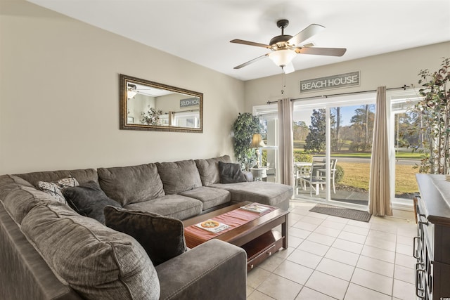 living room featuring ceiling fan and light tile patterned floors