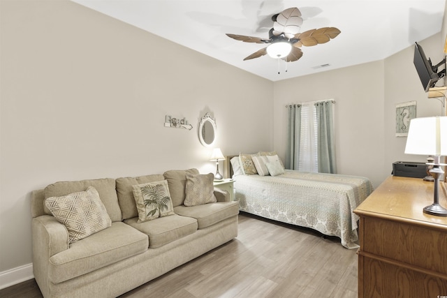 bedroom with hardwood / wood-style floors and ceiling fan