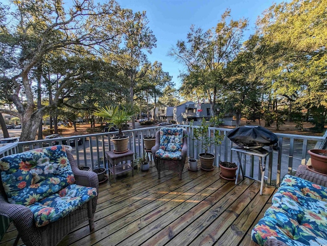 wooden terrace featuring a grill