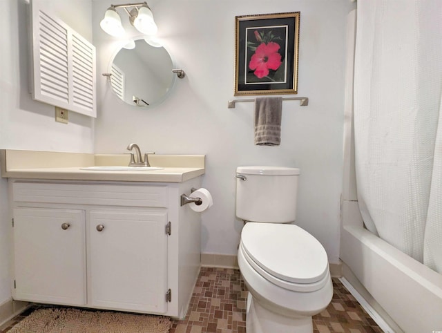 full bathroom featuring vanity, toilet, and shower / bath combo with shower curtain