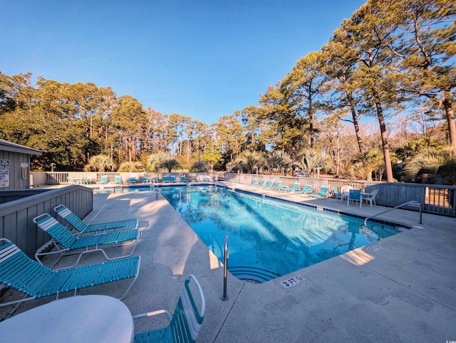 view of swimming pool with a patio area