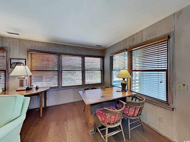 dining space featuring wood-type flooring