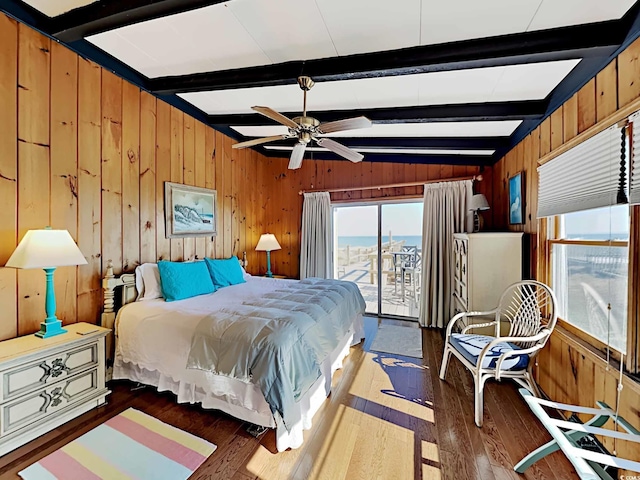 bedroom featuring access to exterior, ceiling fan, dark wood-type flooring, and vaulted ceiling with beams