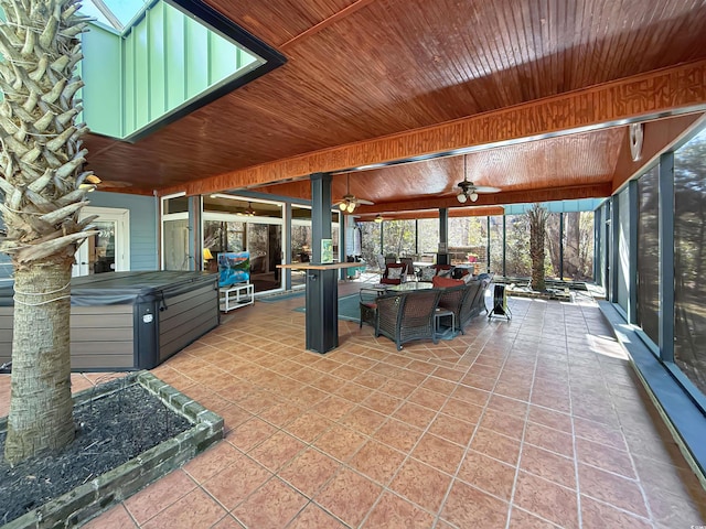 view of patio / terrace with outdoor lounge area, a hot tub, and ceiling fan