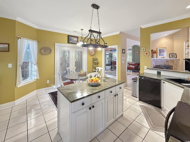 kitchen with stove, white cabinets, black dishwasher, a kitchen island, and hanging light fixtures