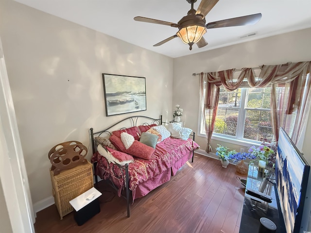 bedroom with ceiling fan and wood-type flooring