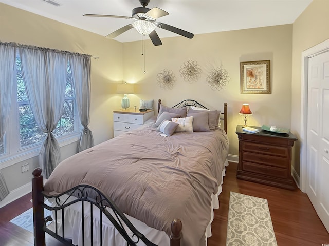 bedroom featuring ceiling fan and dark hardwood / wood-style floors