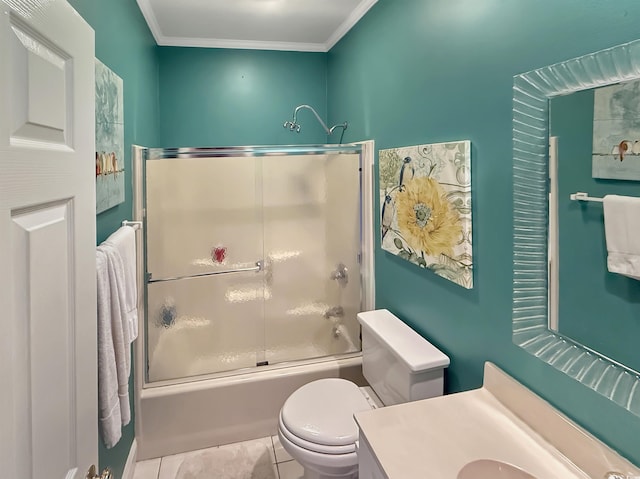 full bathroom featuring tile patterned floors, bath / shower combo with glass door, toilet, vanity, and ornamental molding