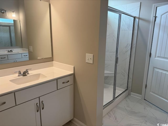 bathroom featuring vanity and an enclosed shower