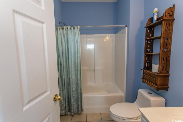 full bathroom with toilet, shower / tub combo, vanity, and tile patterned floors