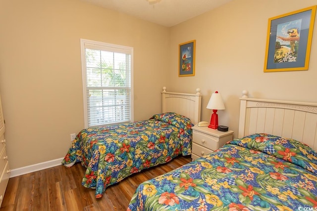 bedroom featuring dark wood-type flooring