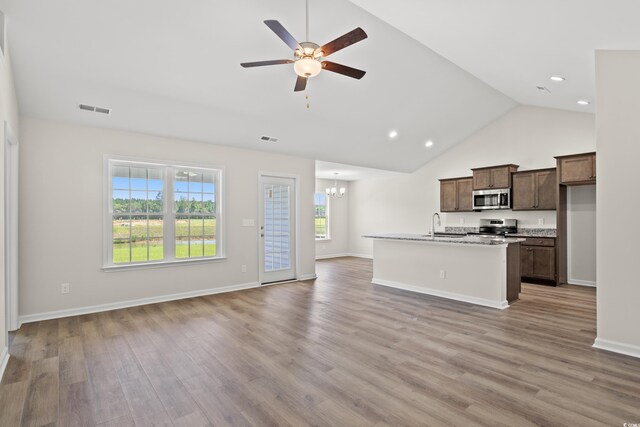 399 Lifestyle Ct, Surfside Beach, SC 29575 - kitchen featuring an island with sink, light wood-type flooring, ceiling fan with notable chandelier, and appliances with stainless steel finishes
