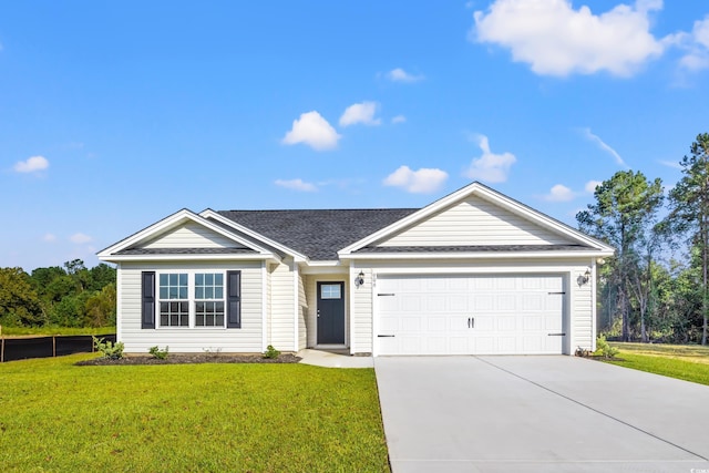 single story home with a garage and a front yard