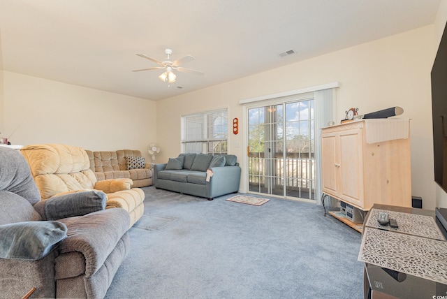 living room featuring ceiling fan and carpet floors