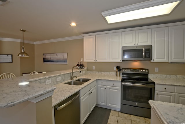 kitchen featuring kitchen peninsula, appliances with stainless steel finishes, sink, pendant lighting, and white cabinetry