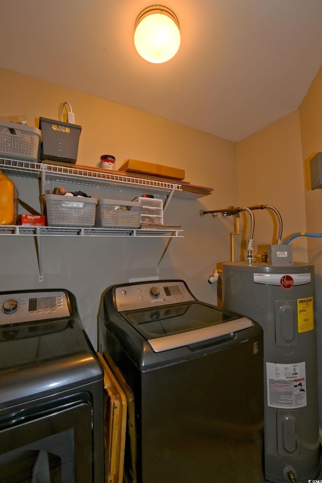 laundry area featuring electric water heater and washer and dryer