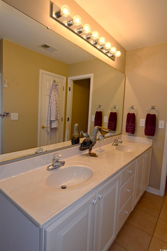 bathroom featuring tile patterned flooring and vanity