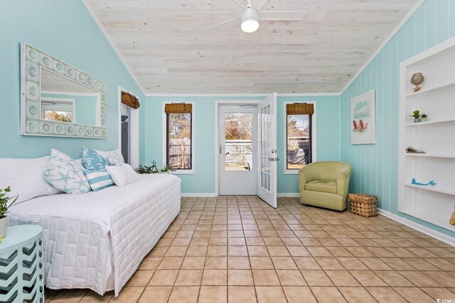 tiled bedroom featuring crown molding, vaulted ceiling, ceiling fan, access to exterior, and wood ceiling