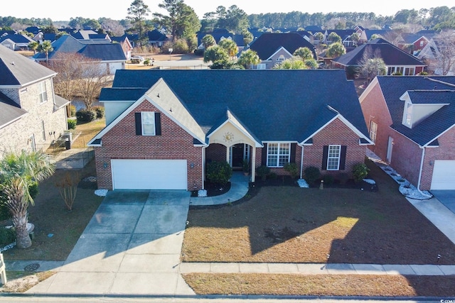 view of front property featuring a garage and a front yard