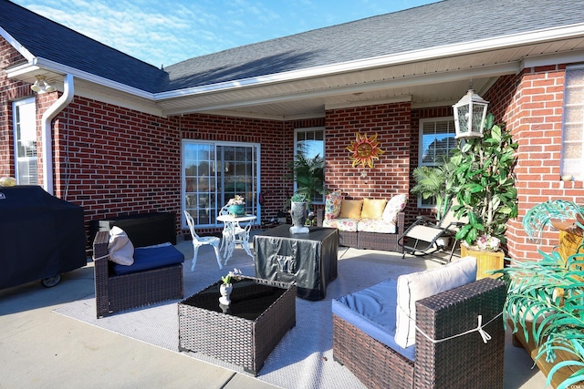 view of patio / terrace with an outdoor living space and a grill