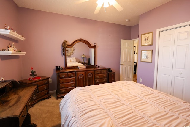 carpeted bedroom featuring a closet and ceiling fan