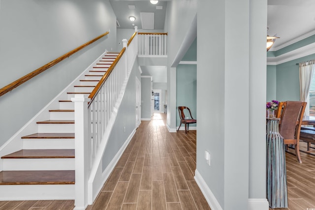 1405 Osprey Pointe Ln, North Myrtle Beach, SC 29582 - stairs with wood finished floors and ornamental molding