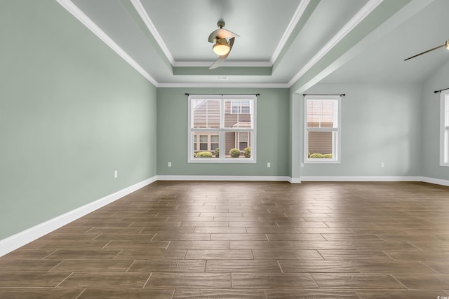 1405 Osprey Pointe Ln, North Myrtle Beach, SC 29582 - spare room with a raised ceiling, wood finish floors, crown molding, and a ceiling fan
