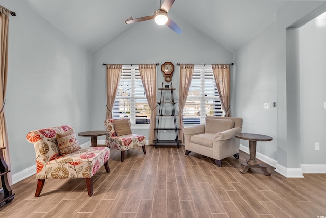 living area with wood-type flooring, vaulted ceiling, and ceiling fan