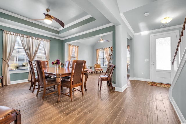 dining space featuring lofted ceiling, ceiling fan, and ornamental molding