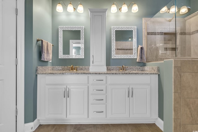 1405 Osprey Pointe Ln, North Myrtle Beach, SC 29582 - bathroom featuring double vanity, tiled shower, and tile patterned flooring