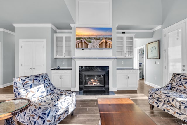 living room featuring a fireplace and ornamental molding