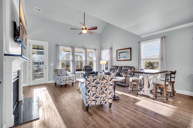 1405 Osprey Pointe Ln, North Myrtle Beach, SC 29582 - living room featuring a ceiling fan, wood finished floors, a fireplace, and high vaulted ceiling